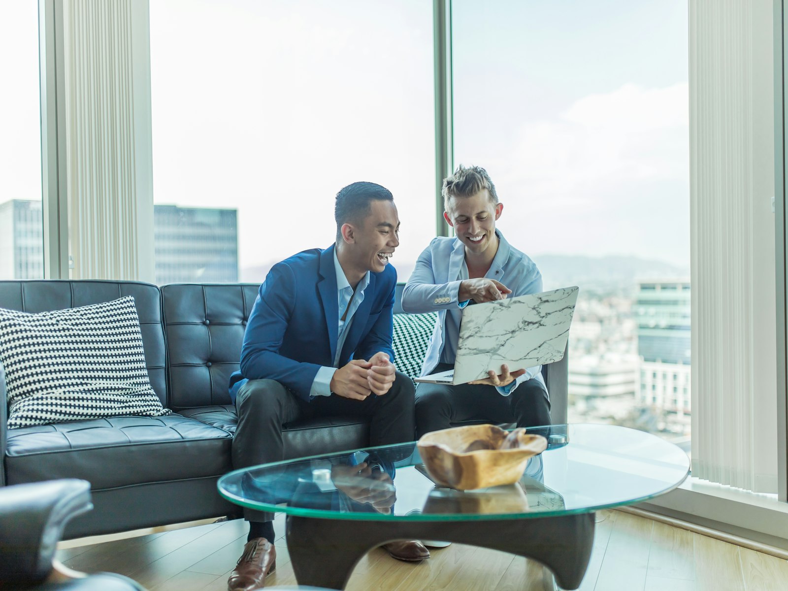 Two advisors reviewing numbers together